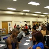 Ailey II dancers Edward Spots and Acura Lacey sign autographs during reception after Lecture Demonstration at HPHS to benefit AileyCamp Kansas: Topeka