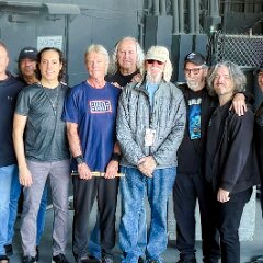 Current and original members of Kansas (l. to r.) Rich Williams, Eric Holmquist, Zak Rizvi, Tom Brislin, Phil Ehart, Ronnie Platt, Kerry Livgren, Dave Hope, Dan McGowan, Joe Deninzon, and Scott Bernard.